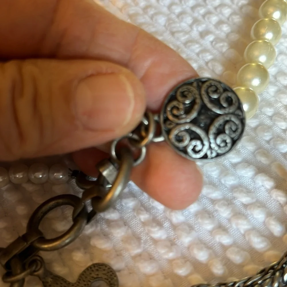 Women’s double chain belt. One of metal objects and the second chain of pearls.